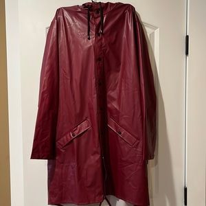 Rains burgundy/red wine colored rain poncho. M/L. 50% PU/50% polyester.